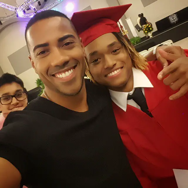 Brad James with Chilli's son at his high school graduation
