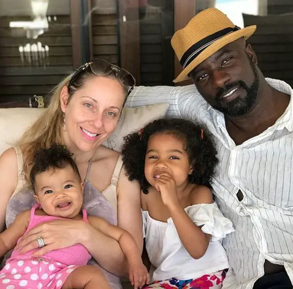 Mike Colter and wife Iva Colter with their daughters circa June 2019