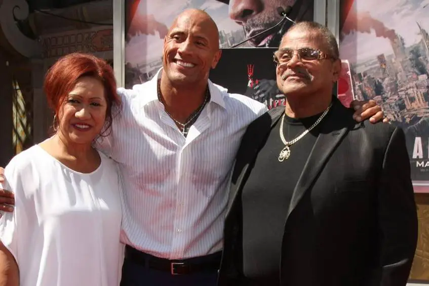 Ata and Rocky with their son Dwayne at an event
