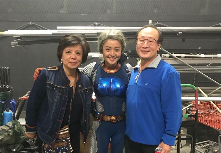 Chelsea Zhang With Her Parents In Set Of Titans