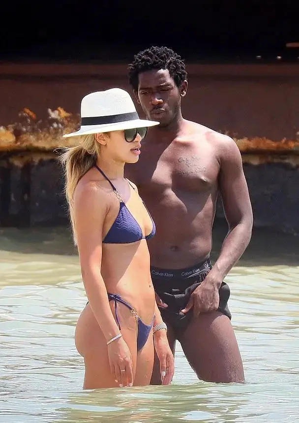 Damson Idris with Montana Brown on a beach 