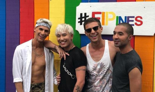 Brand Mondo (Left) and Eric Mondo (third from left) with their friends on gaycation