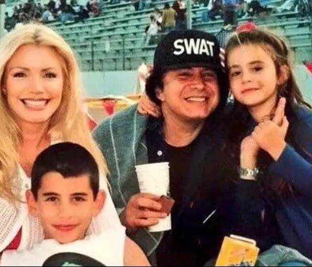 Geneâ€™s family picture with his wife, son, and daughter from several years ago