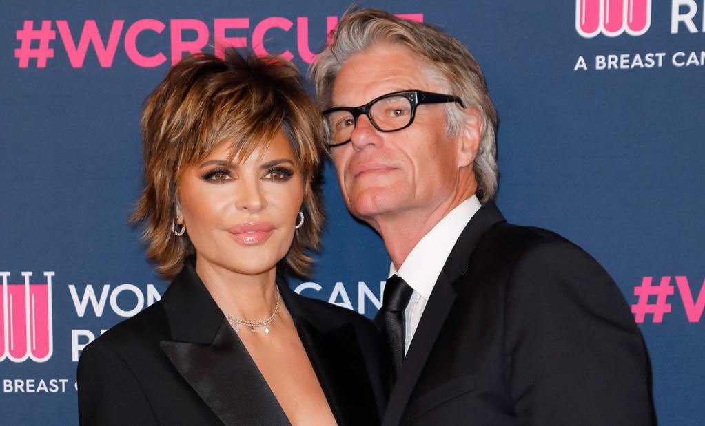 Harry Hamlin Posing with His Wife ( which implies his gay rumor is false)