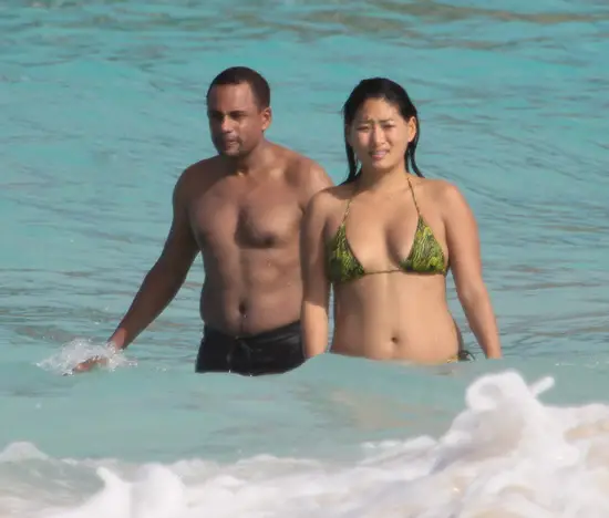 Caption: Hill Harper and Chloe Flower in the water at St.Barts on December ...