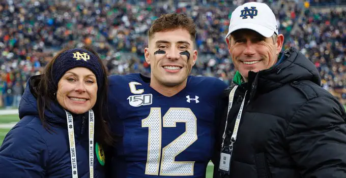 Ian Book With His Mother And Father