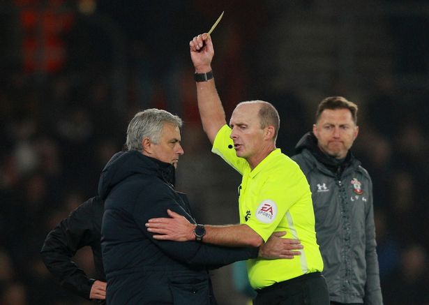 Mike Dean Giving Yellow Card to Josh Mourinho