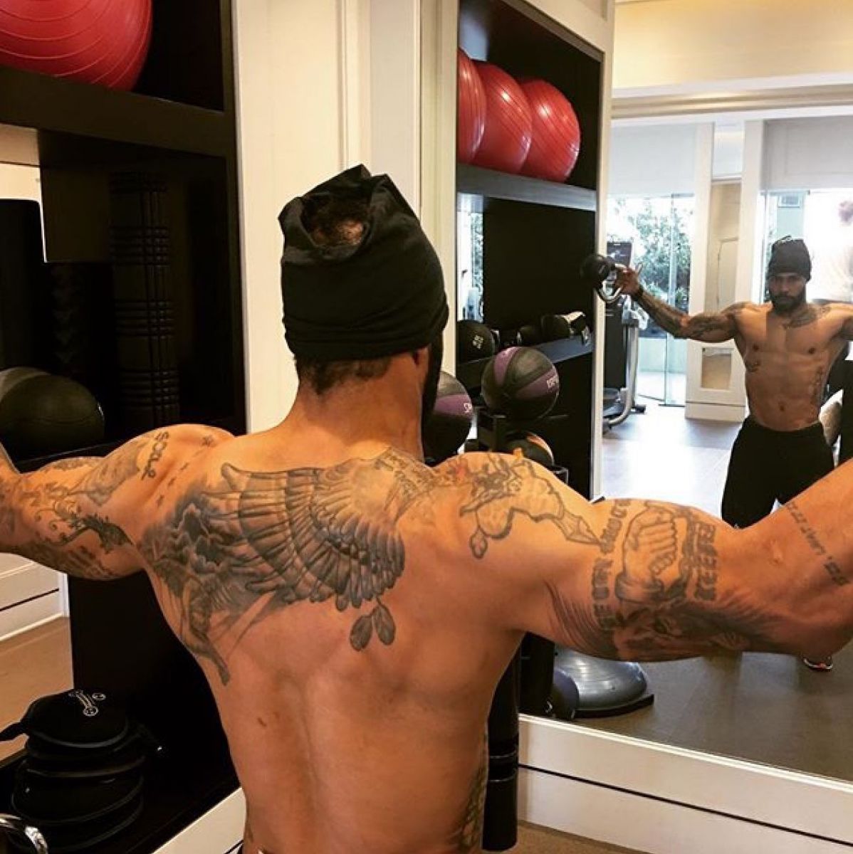 Omari Hardwick's tattoos on display