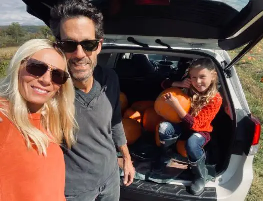 Pete with his wife and daughter having a day out picking pumpkins
