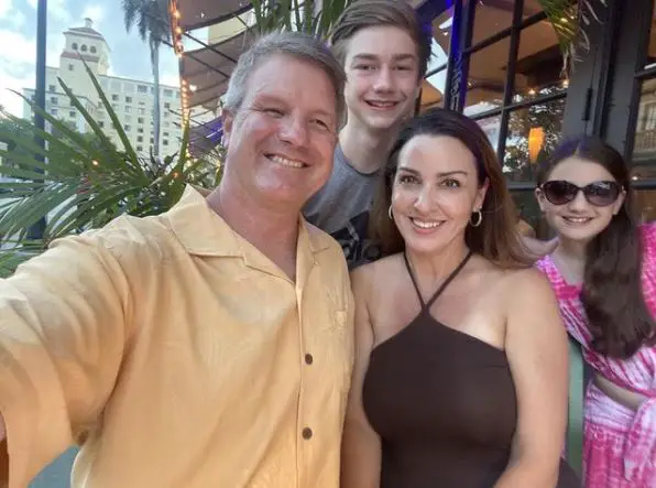 Sara Carter alongside her husband, Martin Bailey, and children