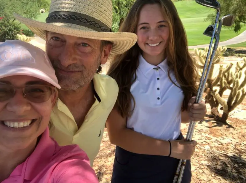 Troy Kotsur while playing golf with his wife and daughter