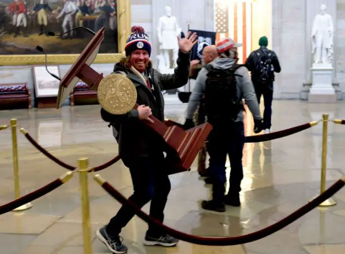 Adam spotted in the US capitol riot, carrying away Nancy Pelosi's lectern 