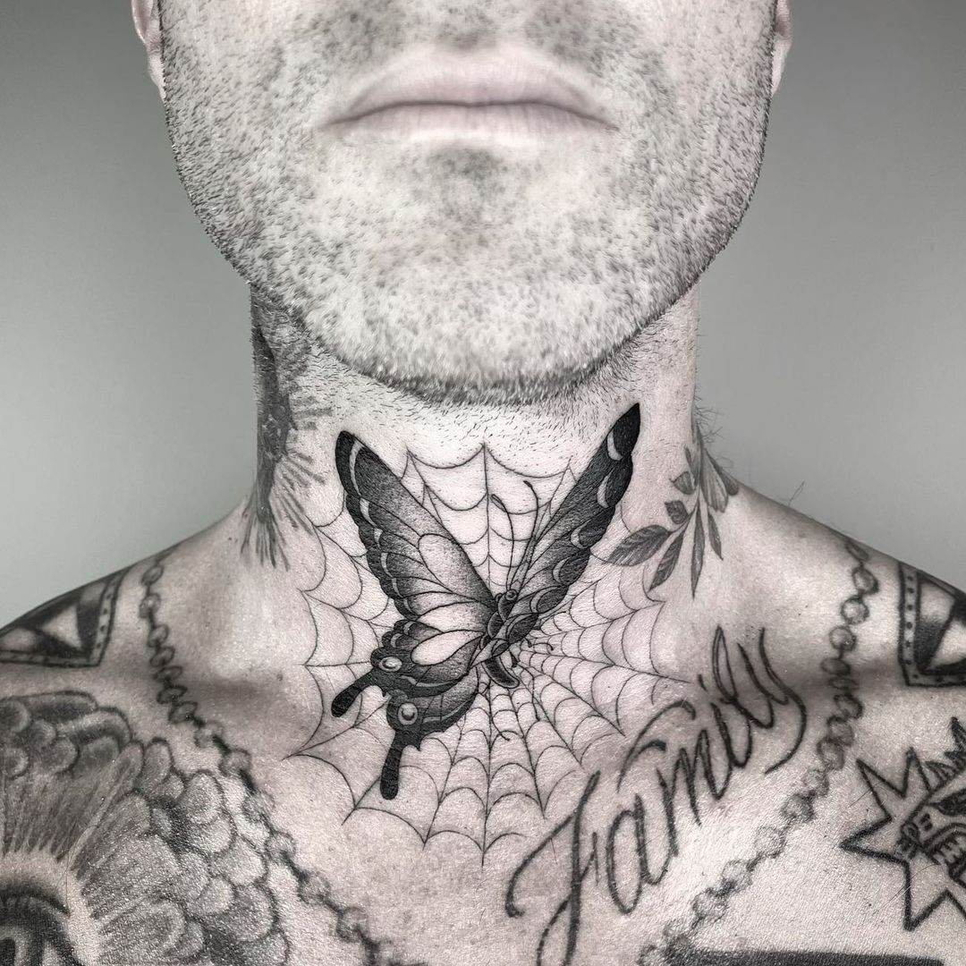 Adamâ€™s spider web tattoo 