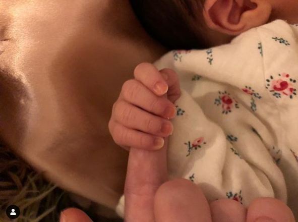Alfie Allen's newborn daughter holds onto her father's finger on 22nd October 2018
