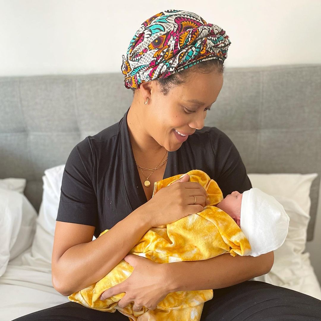 Christina Elmore holding her second son in her arms