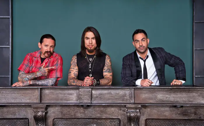 Dave Navarro, in the middle, posing with the judges of Ink Master