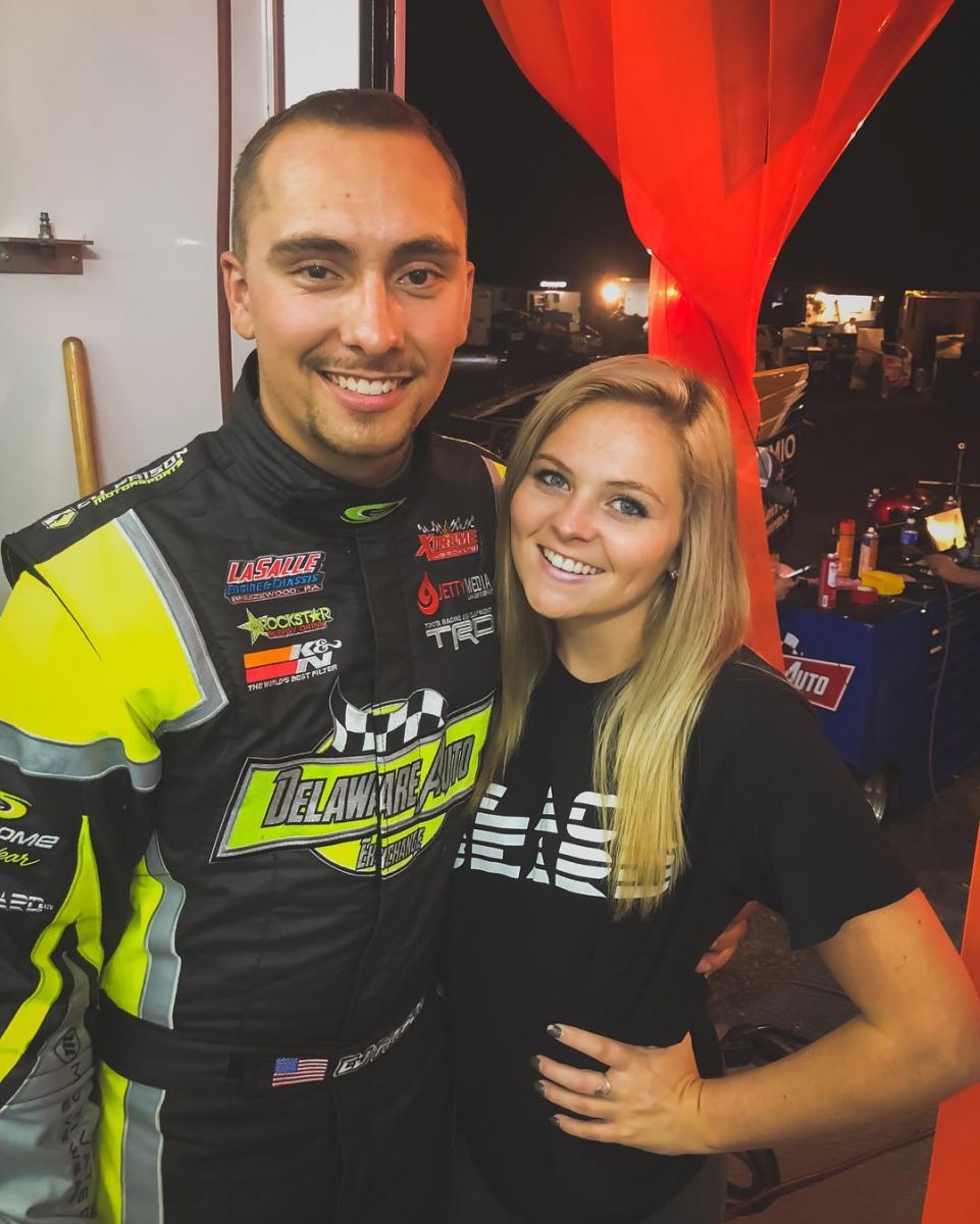 Faison with his girlfriend at a racing event