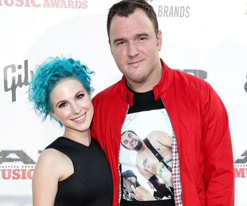 Hayley Williams posing with her former husband, Chad Gilbert 