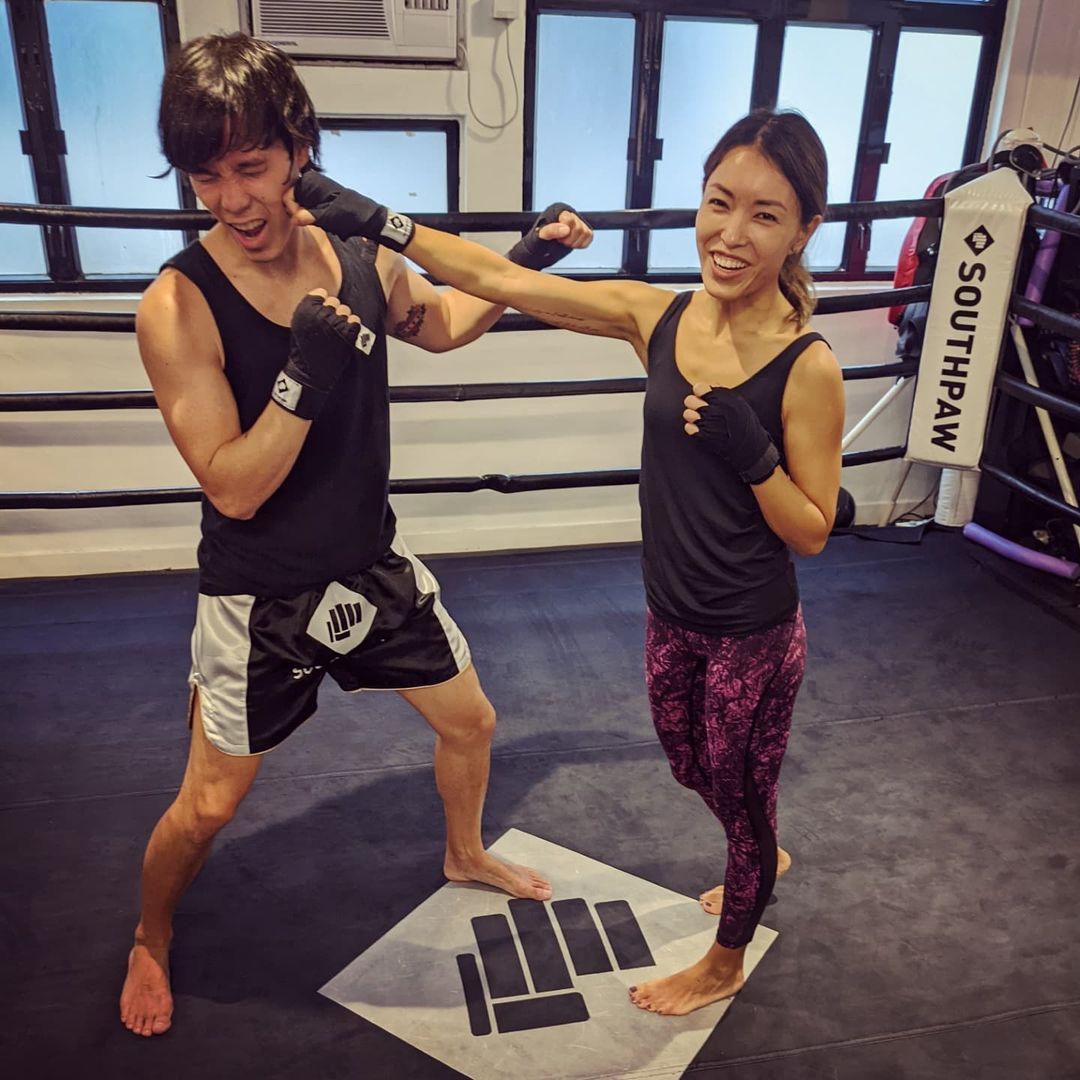 Jason Tobin and his wife being playful while their fitness training