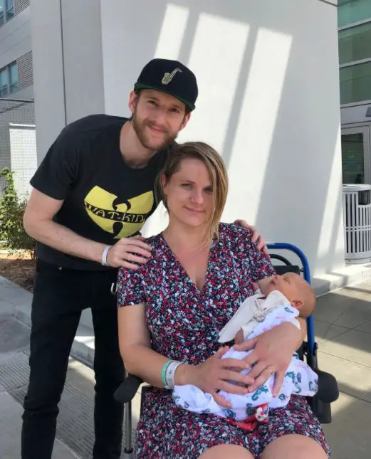 Jeremiah Watkins with his wife and son