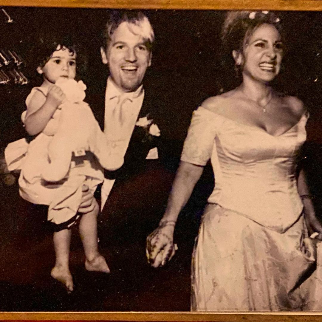 Kathy Najim with her husband from their wedding day which was accompanied by their daughter
