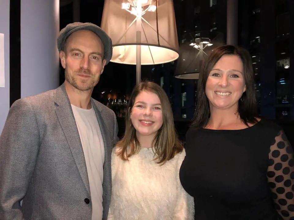 Matthew Gravelle with His Wife and Daughter