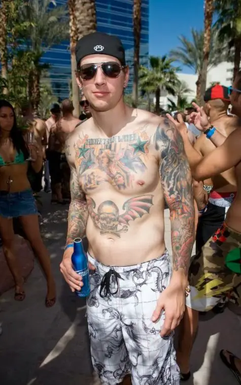 M. Shadow Sporting His Chest & Arm Tattoos During an Event