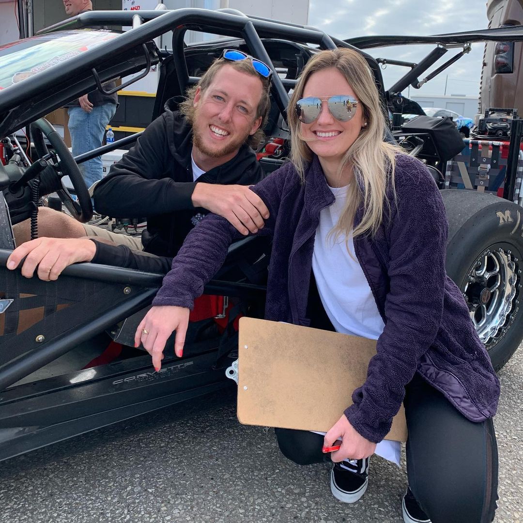 Cleetaâ€™s fiancee posing with her beau on racing track supporting his work