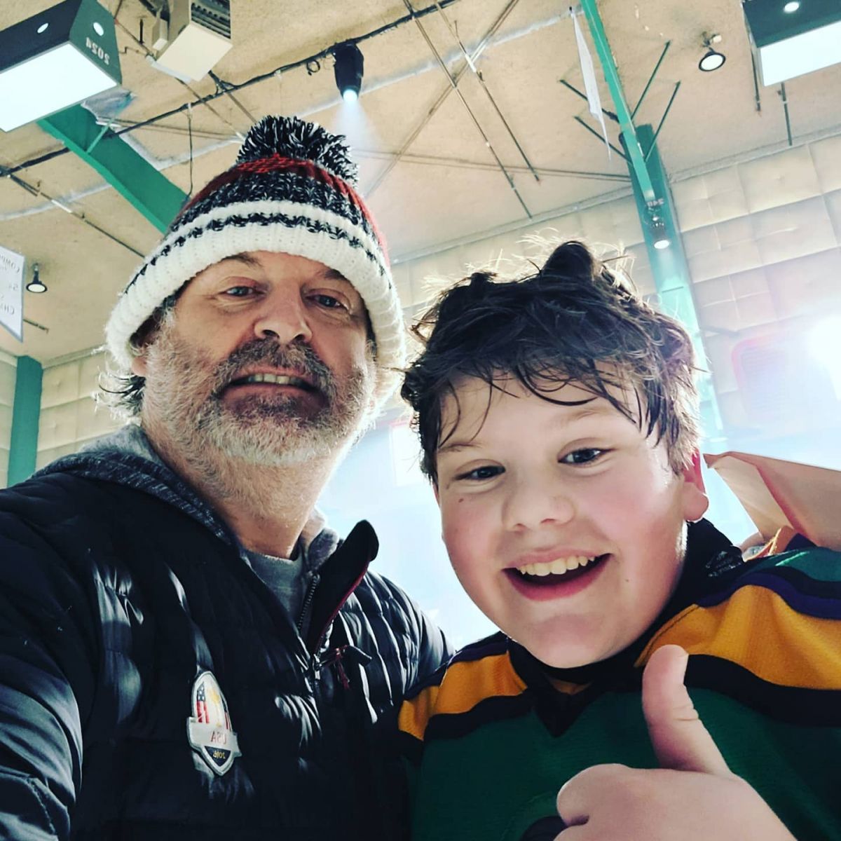 Maxwell Simkins posing with his father for a selfie
