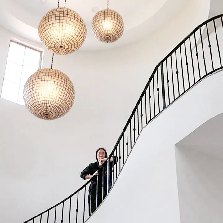 Michele posing on the staircase of her newly bought home in Las Vegas 