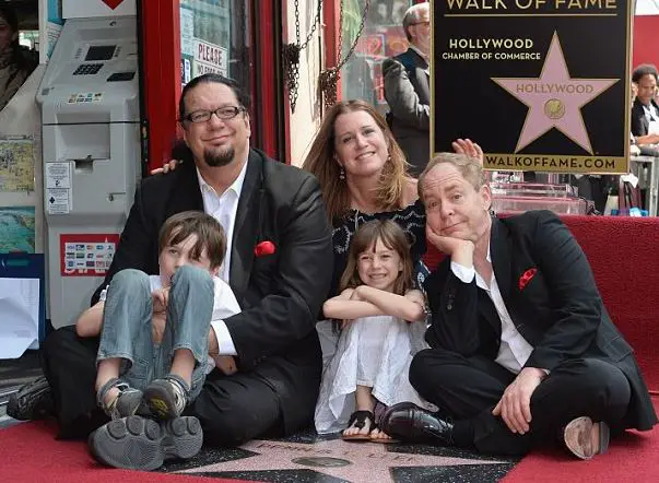 Penn with his spouse, son, daughter, & Teller posing by theÂ Hollywood Walk of Fame