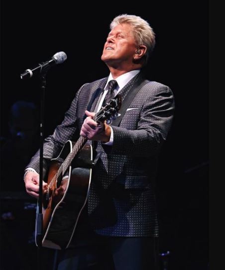 Peter Cetera performing on stage 