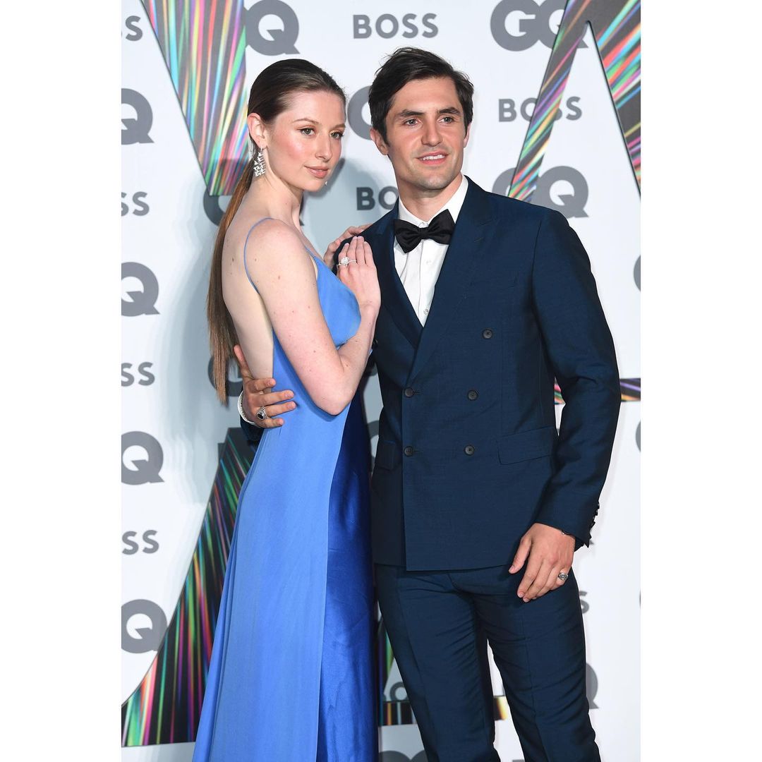 Phil Dunster with his potential wife posing at GQ Awards