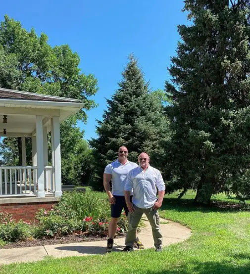 Roger Hazard alongside his husband Chris Stout