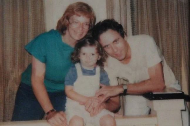Carole Ann Boone (Left), Rose Bundy (Middle) and Ted Bundy (Right) Posing For A Family Picture