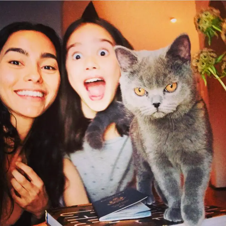 Sandrine with her daughter and their cat