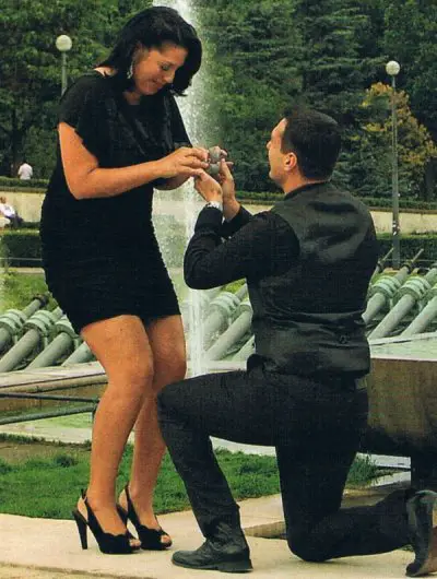 Ryan putting Sara an engagement ring
