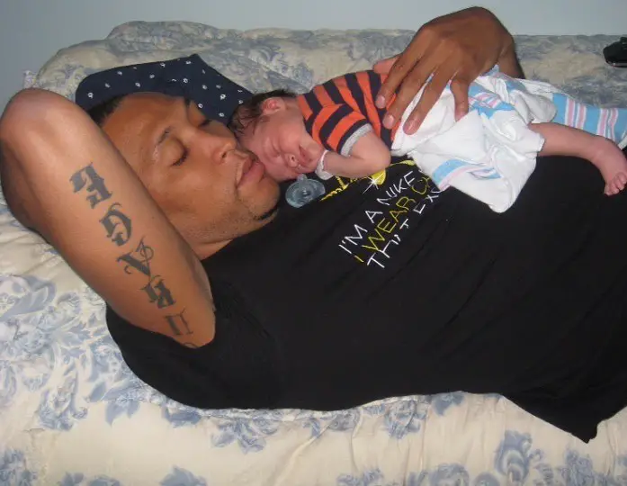 Shawn Marion holding his son, Shawn David Marion