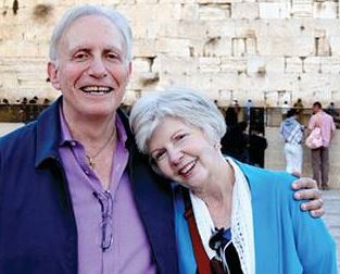 Sid Roth posing with his wife, Joy