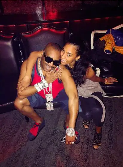 Slick Rick posing with his wife