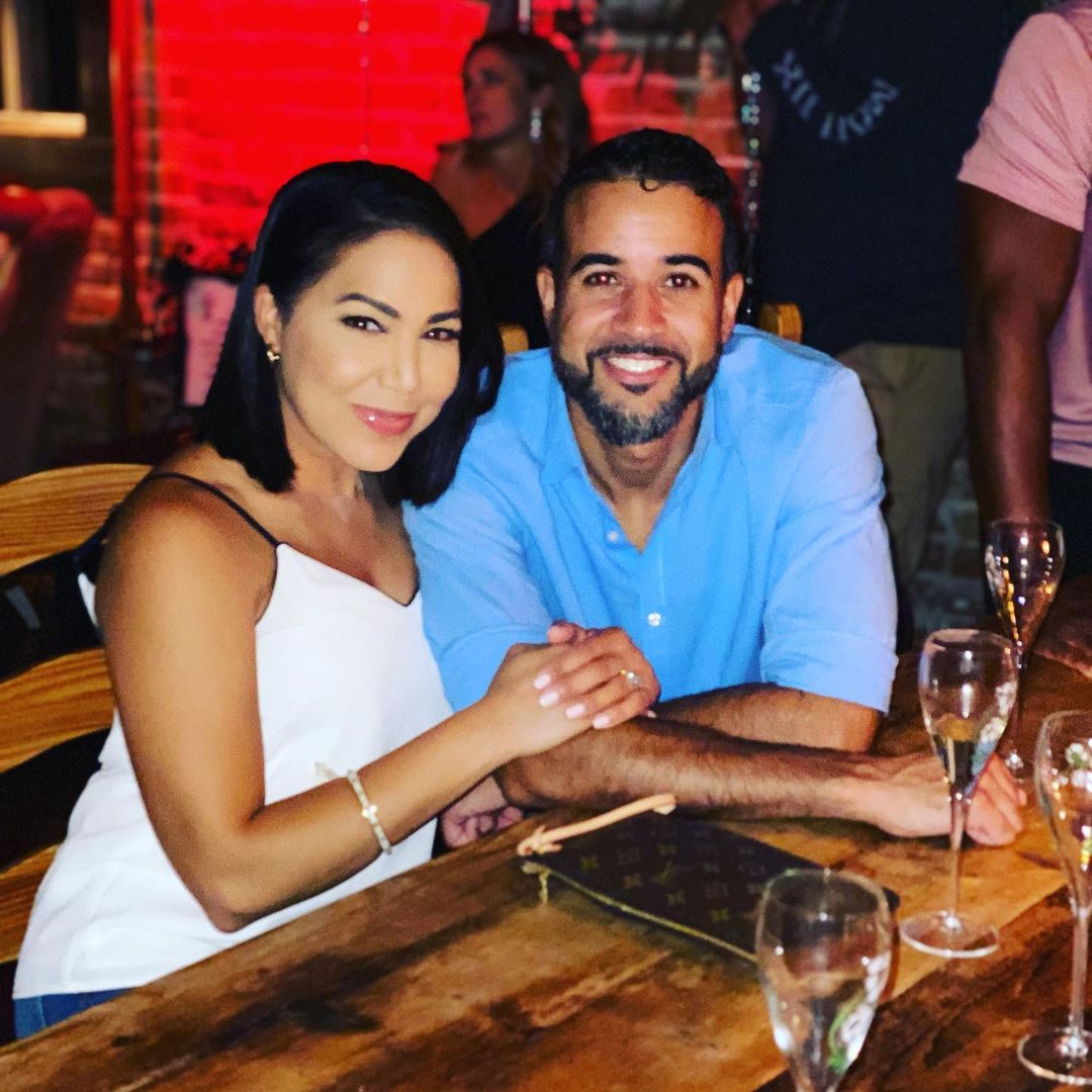Stephanie Ramos and her husband celebrating their anniversary dining at a restaurant 